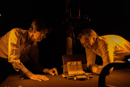 Mike Toth (left) and Will Noel examine an item in PUL’s Digital Imaging Studio. Photo credit: Brandon Johnson