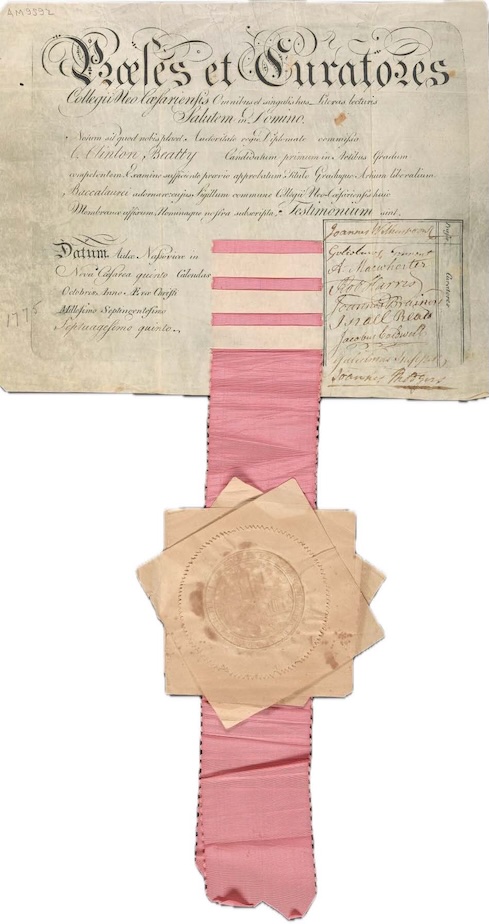 handwritten diploma, with pink ribbon hanging down with Princeton seal 